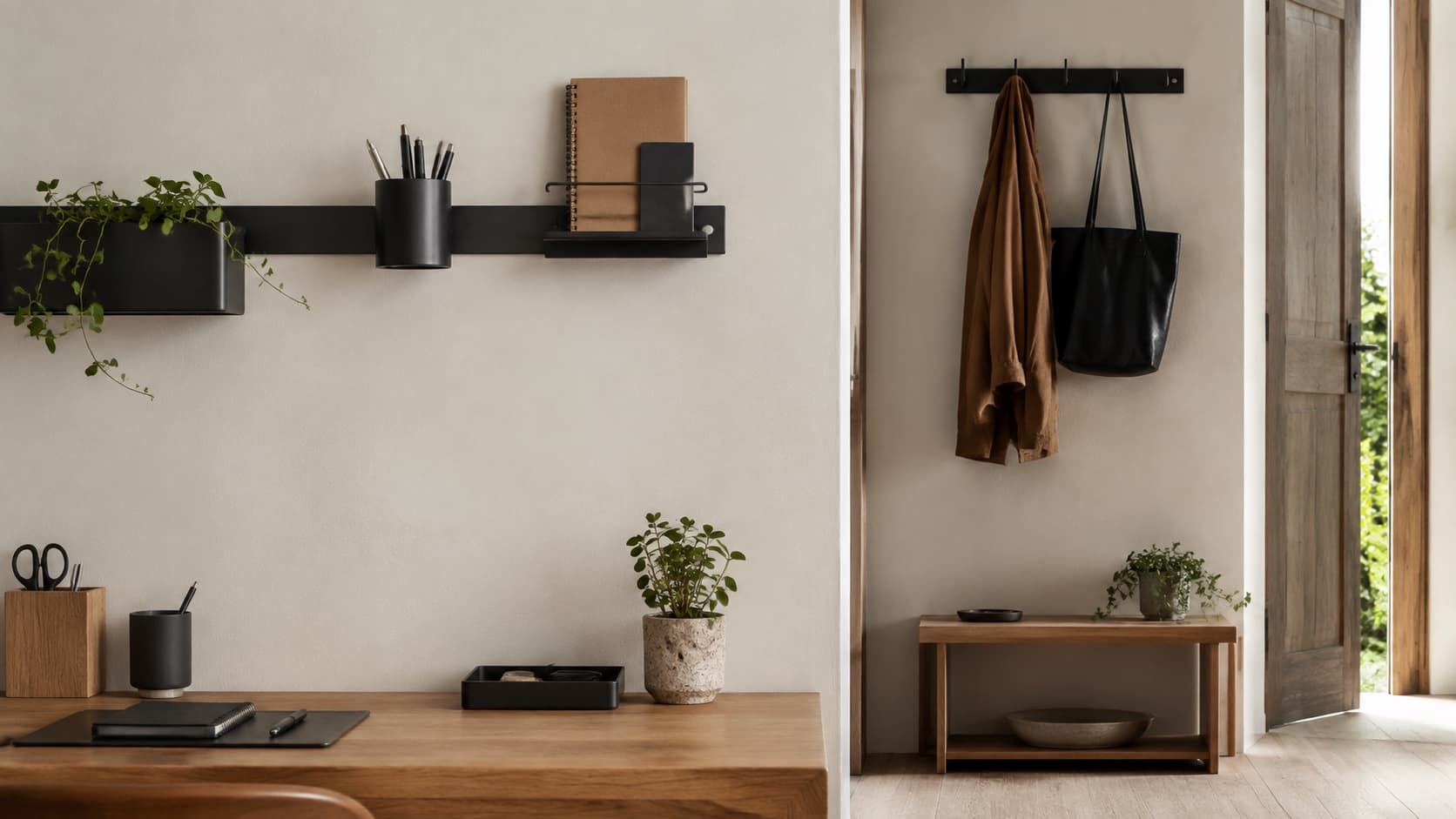 Renter-friendly desk and entryway organised with blackened-steel objects